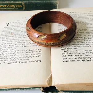 Wooden bangle bracelet with metal flower detail